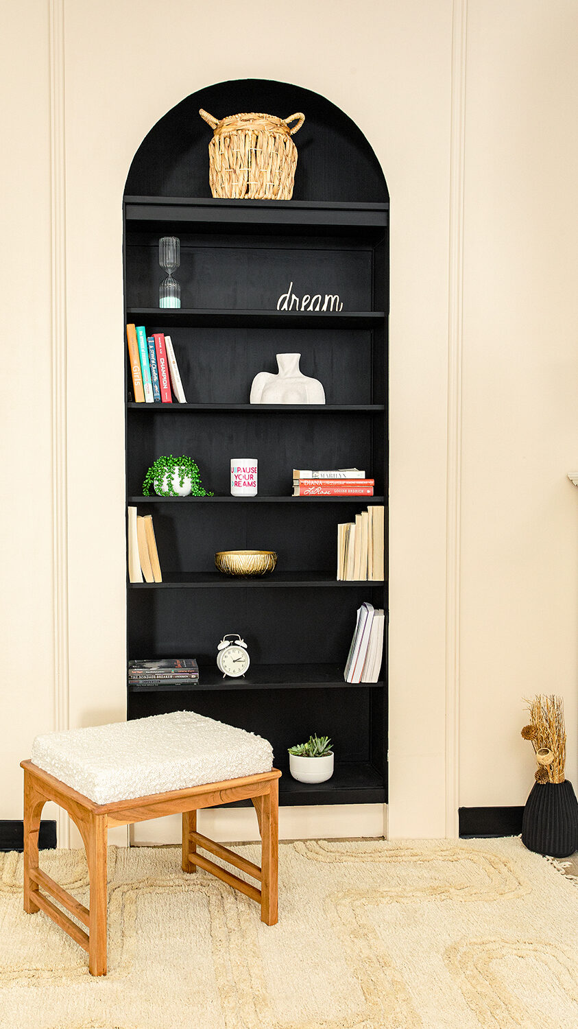 Bookshelf with chair and props for brand photography